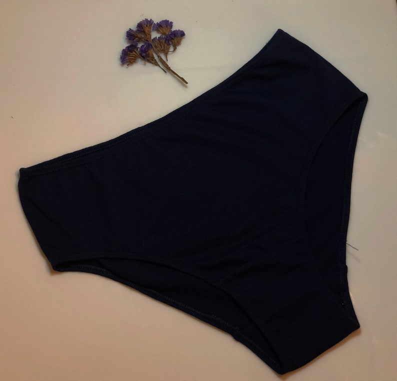 May include: A dark blue pair of underwear made of a soft, stretchy fabric.