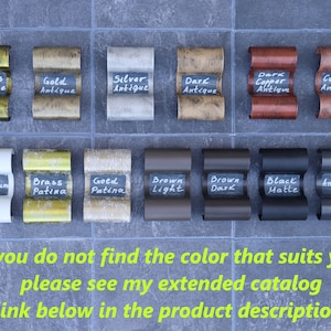 May include: A sample chart of 12 different metal finishes for a product. The finishes include Brass Antique, Gold Antique, Silver Antique, Dark Antique, Copper Antique, Platinum, Brass Patina, Gold Patina, Brown Light, Brown Dark, Black Matte, and Anthracite.