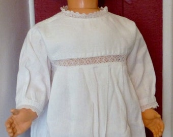 1950s . Little dress with white cotton stitched lace