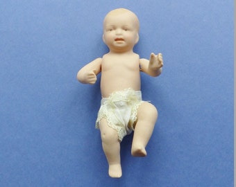 1960s. Miniature porcelain baby.