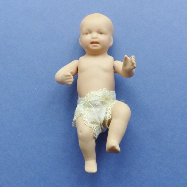 1960s . Bébé porcelaine miniature .