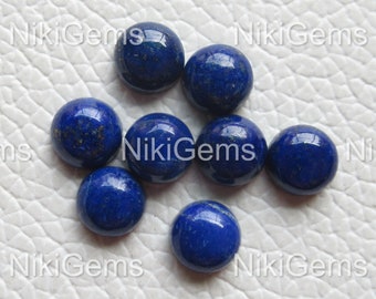 May include: Eight round, blue lapis lazuli cabochons, each with a slightly different shade of blue and a subtle sparkle.
