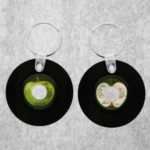 Beatles Let It Be Key Chain. Replica Of The Original 45rpm Record. One Side Of Key Chain Is Side A Other Is Side B.