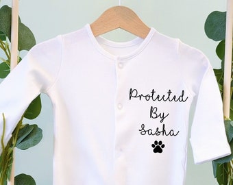 Protected by dog sibling, adorable sleep suit that will be a keep sake forever. Perfect baby gift or for parents to be.