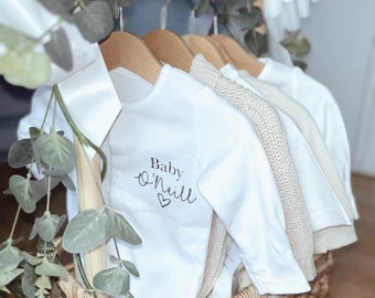 Personalised born in 2023 baby sleep suit (baby surname & heart) mother to be gift.