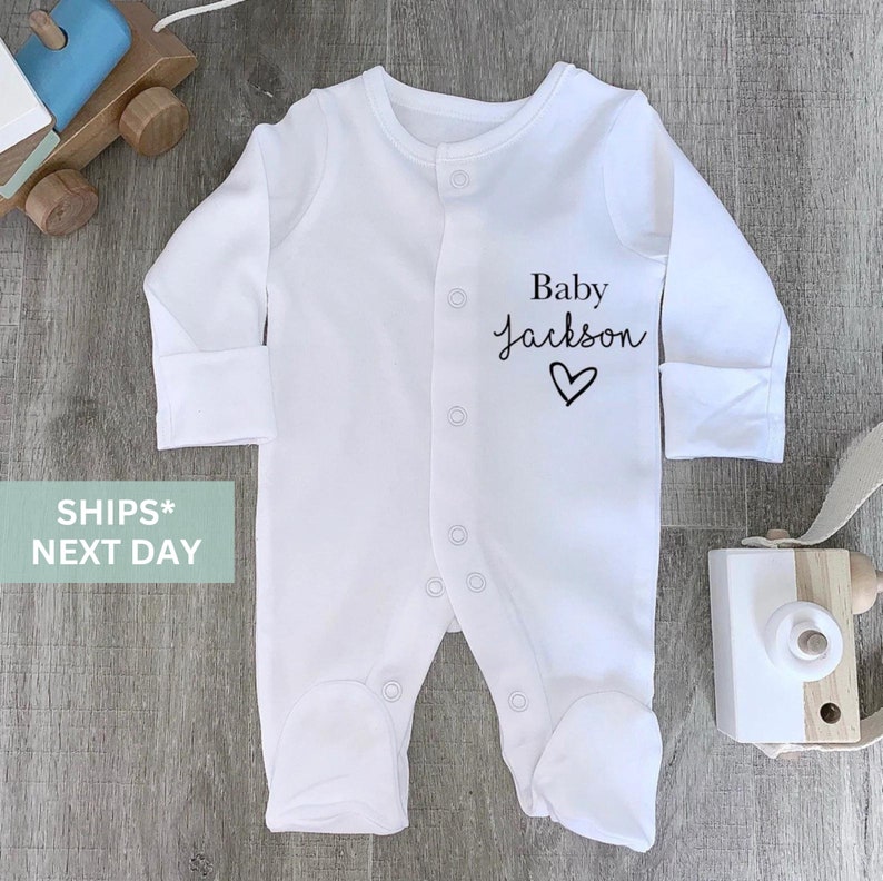 personalised baby sleep suit baby surname & heart image 1