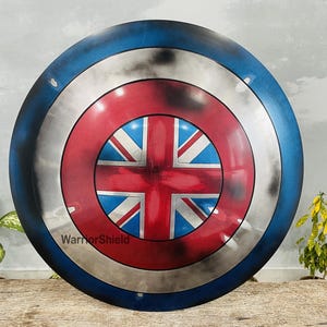 May include: A red, white, and blue Captain America shield with a distressed paint finish. The shield has a Union Jack design in the center.