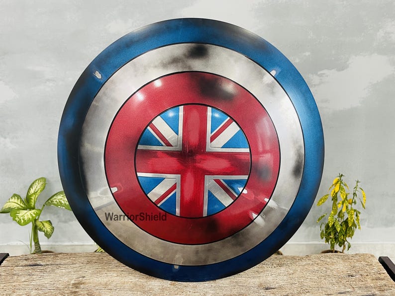 May include: A red, white, and blue Captain America shield with a distressed paint finish. The shield has a Union Jack design in the center.