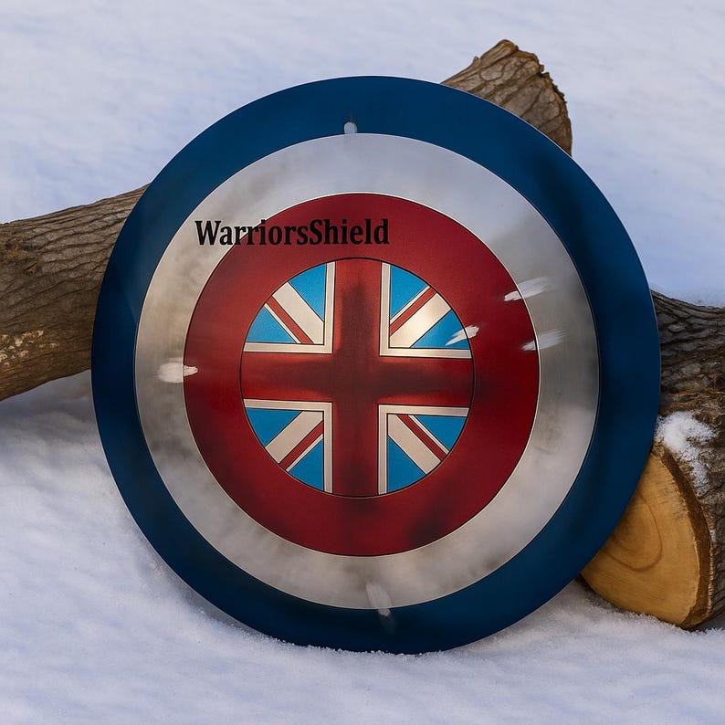 May include: A round shield with a blue outer ring, a silver middle ring, and a red center. The center features a Union Jack design. The text "WarriorsShield" is printed on the shield.