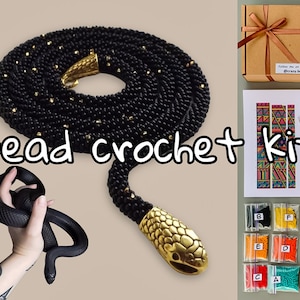 May include: A black beaded crochet snake necklace with gold accents and a snake head clasp. The image also shows a "Bead crochet kit" with beads, needles, and a design card. The snake is held by a hand.