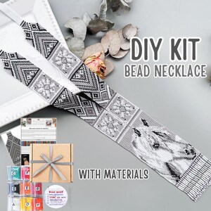 May include: A DIY bead necklace kit featuring a long, flat, woven beaded strip with a black, white, and gray geometric pattern and a horse head design. The kit includes a brown cardboard gift box with a gray ribbon, small containers of beads, thread, and a printed tutorial sheet.