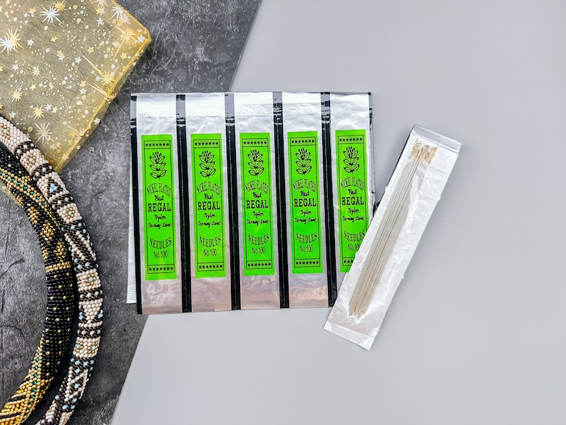 Perfect your craft with Nickel Plated Beading Needles, Regal. Designed for detailed beadwork and jewelry making, these needles are strong, durable, and easy to use. A valuable tool for any crafter.