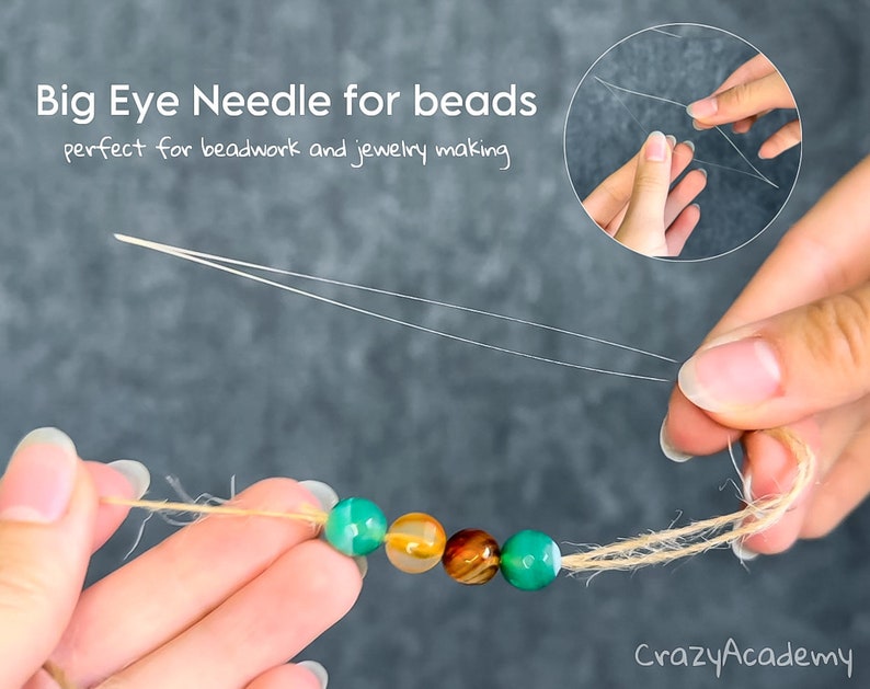 May include: Close-up of a big eye needle threading beads. The image shows a needle with a fine, flexible wire, perfect for beadwork and jewelry making. The text in the image says "Big Eye Needle for beads perfect for beadwork and jewelry making."