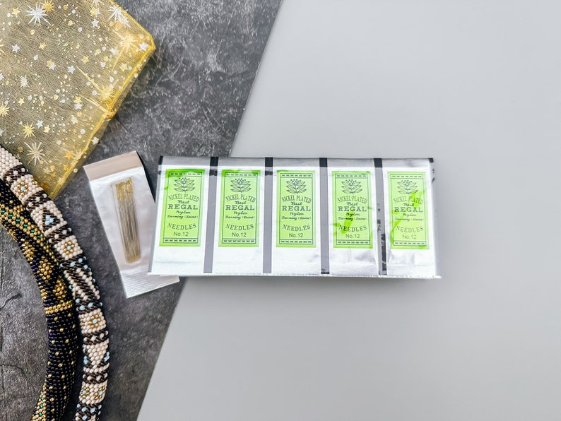 Craft beautiful jewelry with ease using Nickel Plated Beading Needles, Regal Size 12. Perfect for delicate beadwork and intricate designs. High-quality needles that make crafting enjoyable and efficient.