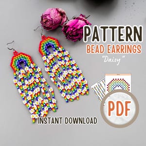 May include: A digital download pattern for beaded earrings. The earrings are long and feature a rainbow arch with white daisy flowers. The pattern is called "Daisy" and is available as a PDF download.