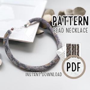 May include: A beaded necklace with a snake-like pattern in shades of gray, yellow, and black. The necklace is displayed on a white surface with the text "PATTERN BEAD NECKLACE" and "INSTANT DOWNLOAD" and a PDF icon.