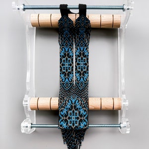 Elevate your jewelry-making skills with this Beading Loom. The perfect tool for beadwork lovers, this DIY kit allows you to create intricate patterns for necklaces, bracelets, and more. Get yours today and start crafting custom jewelry with ease!