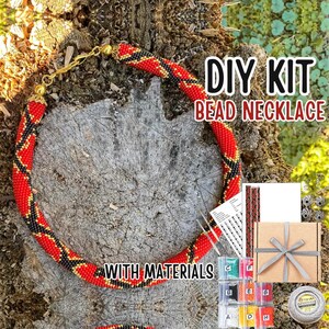 May include: DIY bead necklace kit with all the materials needed to create a red, black and gold beaded necklace. The kit includes beads, thread, needles and instructions.