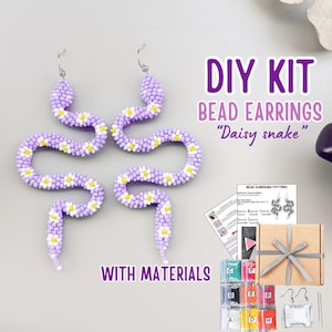 May include: A DIY kit for making beaded "Daisy snake" earrings. The earrings are shaped like snakes with lavender and white beads, accented with yellow centers. The kit includes materials, a pattern, and a gift box.