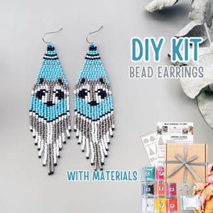 May include: Handmade beaded earrings with a wolf design, in light blue, grey, black, and white. The earrings are part of a DIY kit, including materials and instructions. The text "DIY KIT BEAD EARRINGS WITH MATERIALS" is visible.