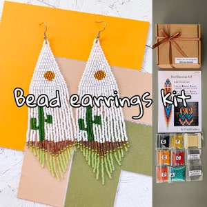 May include: A bead earrings kit with white, green, and yellow beads. The kit includes all the materials needed to make a pair of earrings, including beads, thread, and needles. The kit also includes instructions on how to make the earrings. The instructions are written in English. The kit is packaged in a brown box with a white ribbon.