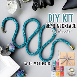 May include: A DIY bead necklace kit with materials. The turquoise beaded necklace is in a snake shape with gold-coloured accents. The kit includes beads, string, and a gift box. Text on the image says "DIY KIT BEAD NECKLACE Royal snake WITH MATERIALS."