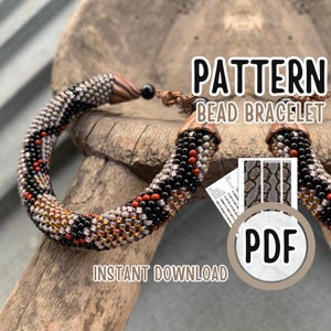 May include: A beaded bracelet with a pattern of black, red, and gold beads. The bracelet is displayed on a piece of wood. The image includes the text "PATTERN BEAD BRACELET" and "PDF INSTANT DOWNLOAD".