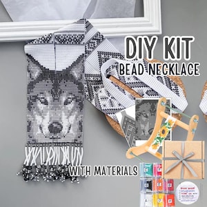 May include: A DIY bead necklace kit with materials. The finished necklace features a wolf design in shades of gray and white. The kit includes beads, thread, and a wooden frame. Text on the image reads "DIY KIT BEAD NECKLACE WITH MATERIALS."