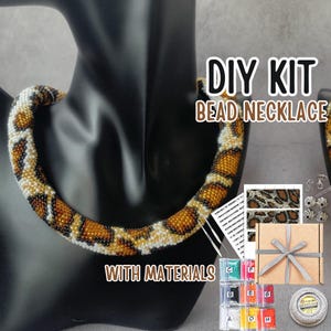 May include: DIY bead necklace kit with materials. The kit includes beads, thread, needles, and instructions. The necklace is a brown and white beaded design with a leopard print pattern.