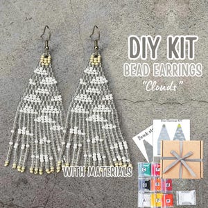 May include: DIY bead earring kit with materials. The kit includes white and silver beads, instructions, and a small box. The earrings are designed to look like clouds.