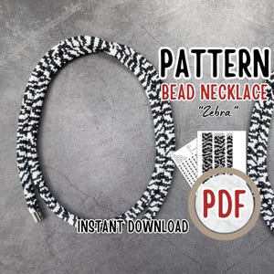 以下が含まれることがあります： ゼブラ柄の白黒ビーズネックレス。画像には、ネックレスのPDFパターンが含まれており、「PATTERN BEAD NECKLACE Zebra」と「INSTANT DOWNLOAD」という文字があります。「PDF」という文字が入った丸いボタンも表示されています。