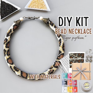 May include: DIY bead necklace kit featuring a tiger python design. The kit includes all the materials needed to create the necklace, including beads, thread, and instructions.