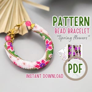 May include: A beaded bracelet pattern with a floral design. The pattern is called "Spring Flowers" and is available as a PDF download. The bracelet is made with pink, white, green, and purple beads.