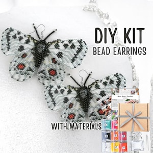 May include: A DIY kit for making beaded butterfly earrings. The earrings are white with black and red accents. The kit includes materials, instructions, and a gift box. Text on the image reads "DIY KIT BEAD EARRINGS WITH MATERIALS."