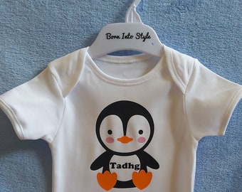 baby clothes with penguins on them