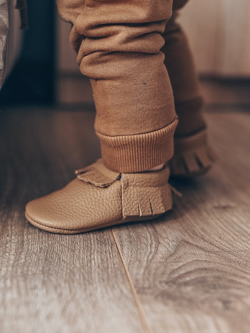 Soft sole barefoot baby moccasins with custom name, flexible leather shoes for newborn, ideal for early walking stages