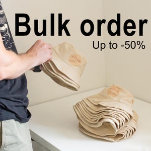 May include: A stack of beige bucket hats with a red bird logo. The text "Bulk order Up to -50%" is visible in the image.