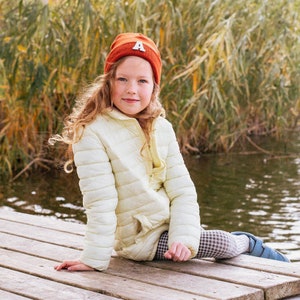 Our baby hats with names are the perfect way to keep your baby warm and stylish this winter. Choose from a variety of colors and designs, and add your baby's name for a personalized touch.