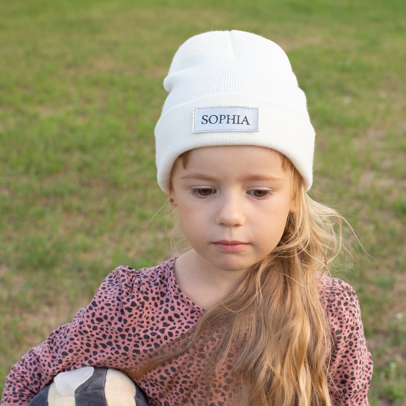 Our kids beanie hats with names are the perfect way to keep your child warm and stylish this winter. Choose from a variety of colors and designs, and add your child's name for a personalized touch.