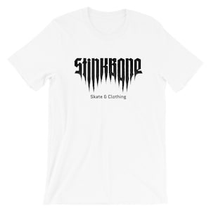 May include: White t-shirt featuring the black text "STINKBONE" in a gothic font above "Skate & Clothing". The shirt has a crew neck and is made of a soft material.