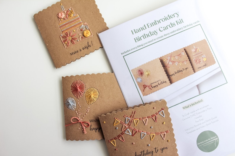 May include: A hand embroidery kit for creating three birthday cards. The kit includes brown cardstock, embroidery floss, and instructions. The cards feature designs of a cake, balloons, and bunting.