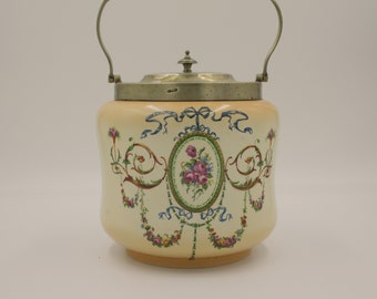 very collectible Shelley Foley lidded biscuit canister with a swing handle and delightful red rose and blue ribbon motif