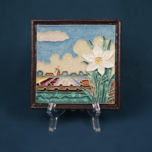 antique polychrome tile from Delft Holland featuring a daffodil, old style windmill, and a lovely blue sky intricate & colorful detail