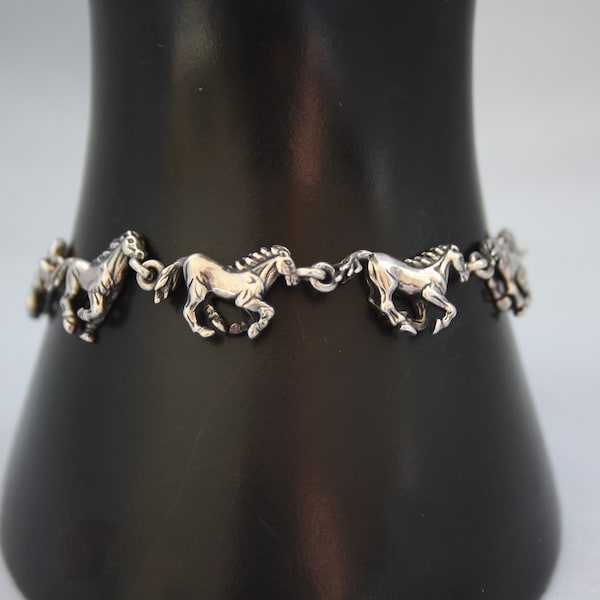 genuine quality Kabana sterling link bracelet featuring racing horses, horses symbolize freedom, strength and beauty