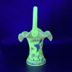 exquisite Fenton Burmese glass UV reactive ruffled basket with a hand painted blue bird which symbolizes hope, love, harmony & renewal