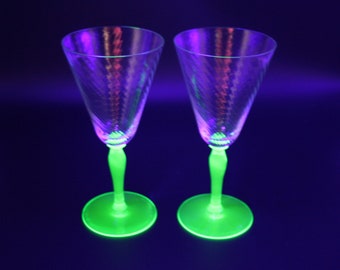 pair of elegant Fostoria Optic Swirl uranium wine glasses from the 1930's