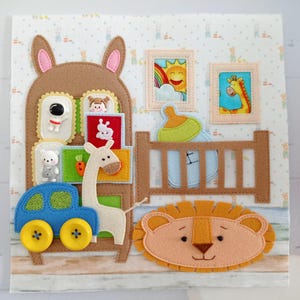 May include: A colorful felt baby activity board featuring a bunny-shaped cabinet with toy blocks, a car, a giraffe, and a lion. The board also includes a crib, a bottle, and framed pictures of a rainbow and a giraffe.