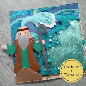 Puede incluir: Una página de libro tranquilo de fieltro que representa una escena bíblica. Una figura con barba y bastón se encuentra frente a un mar turquesa con una ola. La página incluye lentejuelas y el texto "Pattern + Tutorial".