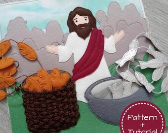 May include: A felt craft depicting a biblical scene with a figure in white robes and a red sash, surrounded by bread, fish, and mountains. The background features a sky and the text "Pattern + Tutorial" in a circular design.
