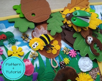 May include: A colorful felt craft project featuring various insects and floral elements. The design includes a large bee, a beetle, and several flowers and leaves. The text "Pattern + Tutorial" is visible in a blue circle.
